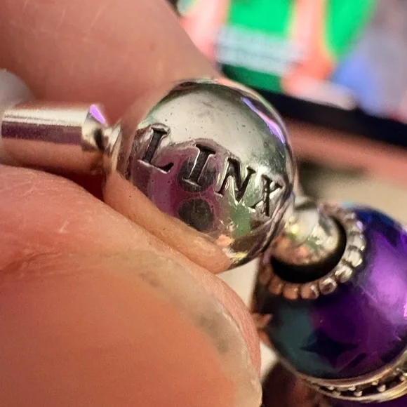Linx bracelet with owl and butterfly charms